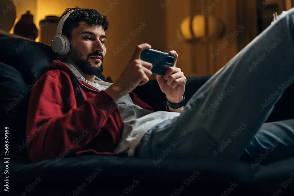 Person wearing headphones playing video games